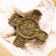 The cross-shaped pendant found in the woman’s grave.